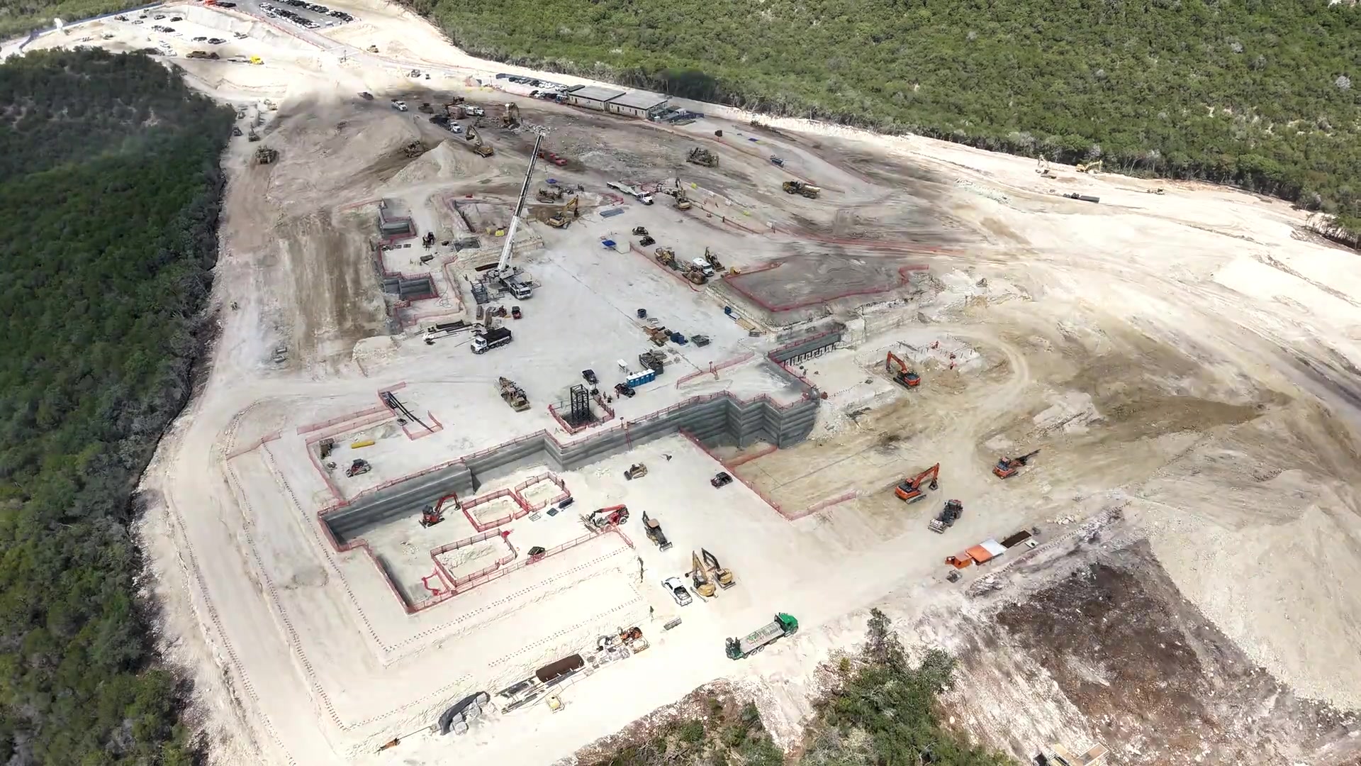 Aerial view of the Four Seasons Private Residences Lake Austin construction site beside Lake Austin.
